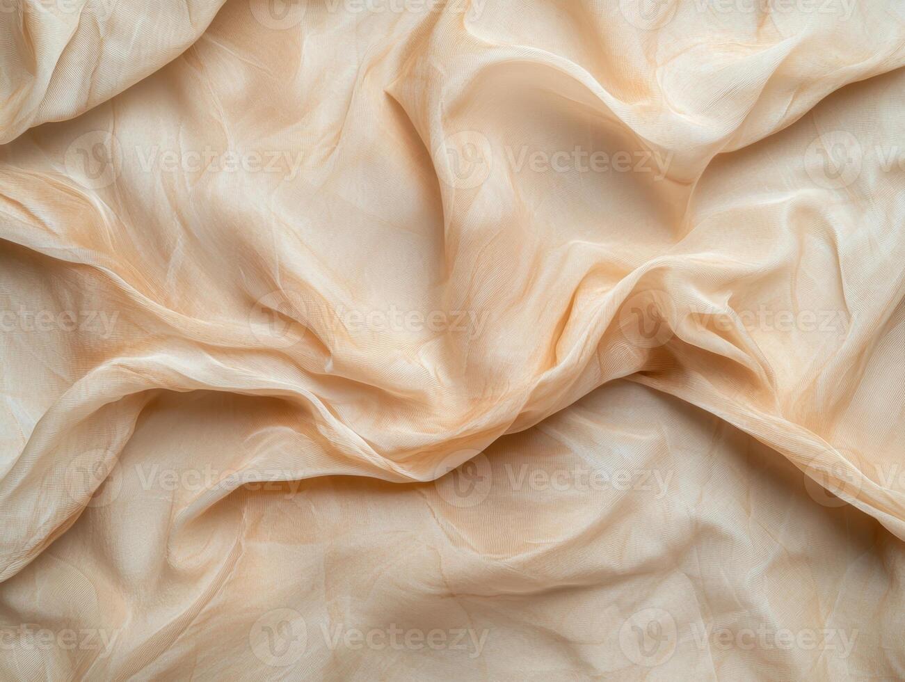 Close up of draped beige fabric with soft folds and wrinkles photo