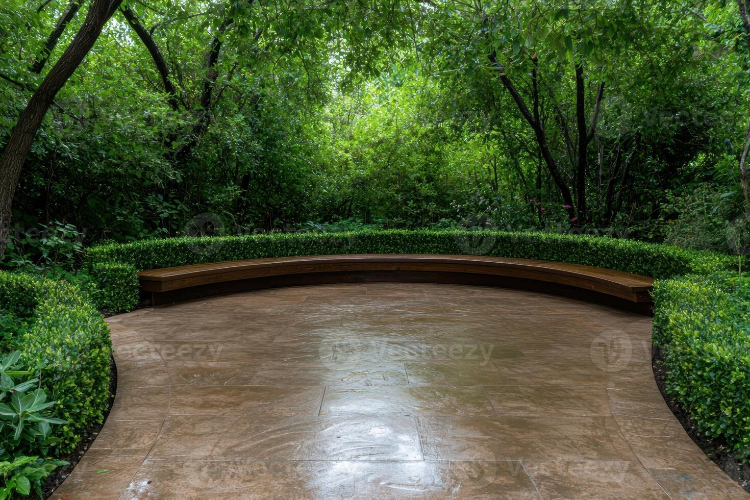 Serene curved bench in a lush green garden photo
