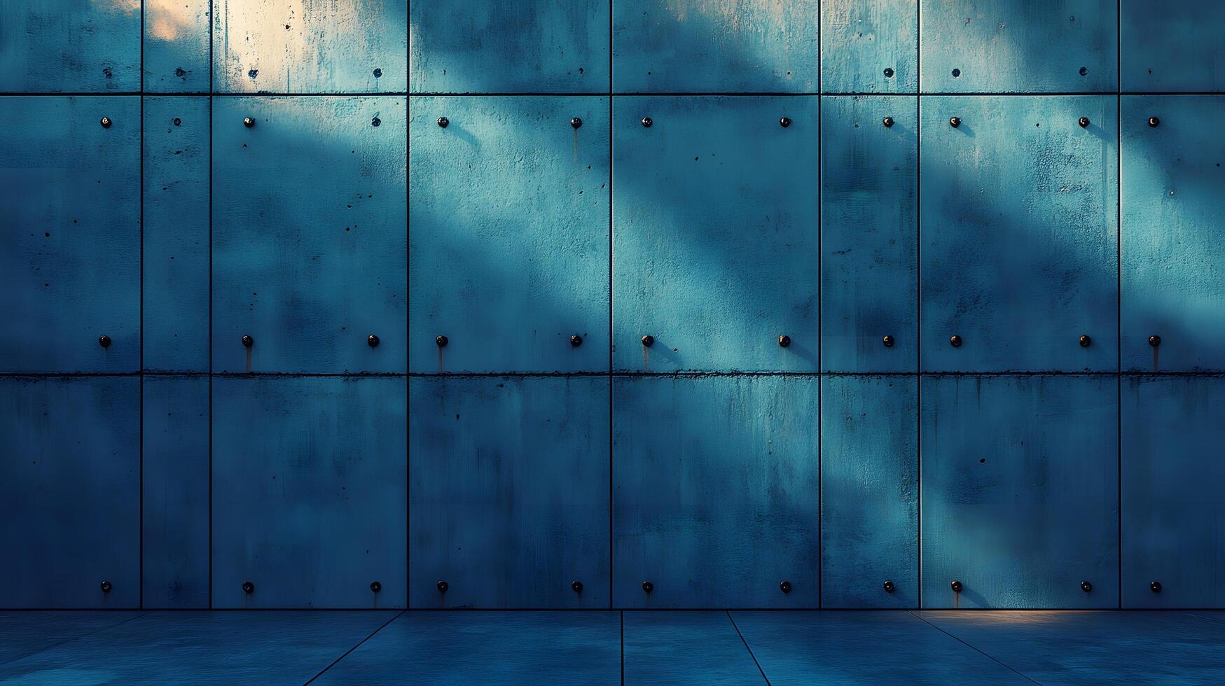 Industrial concrete wall with dramatic downlighting and blue-tinted surface, featuring geometric panel patterns and metallic rivets in modern brutalist architectural style. proportion photo