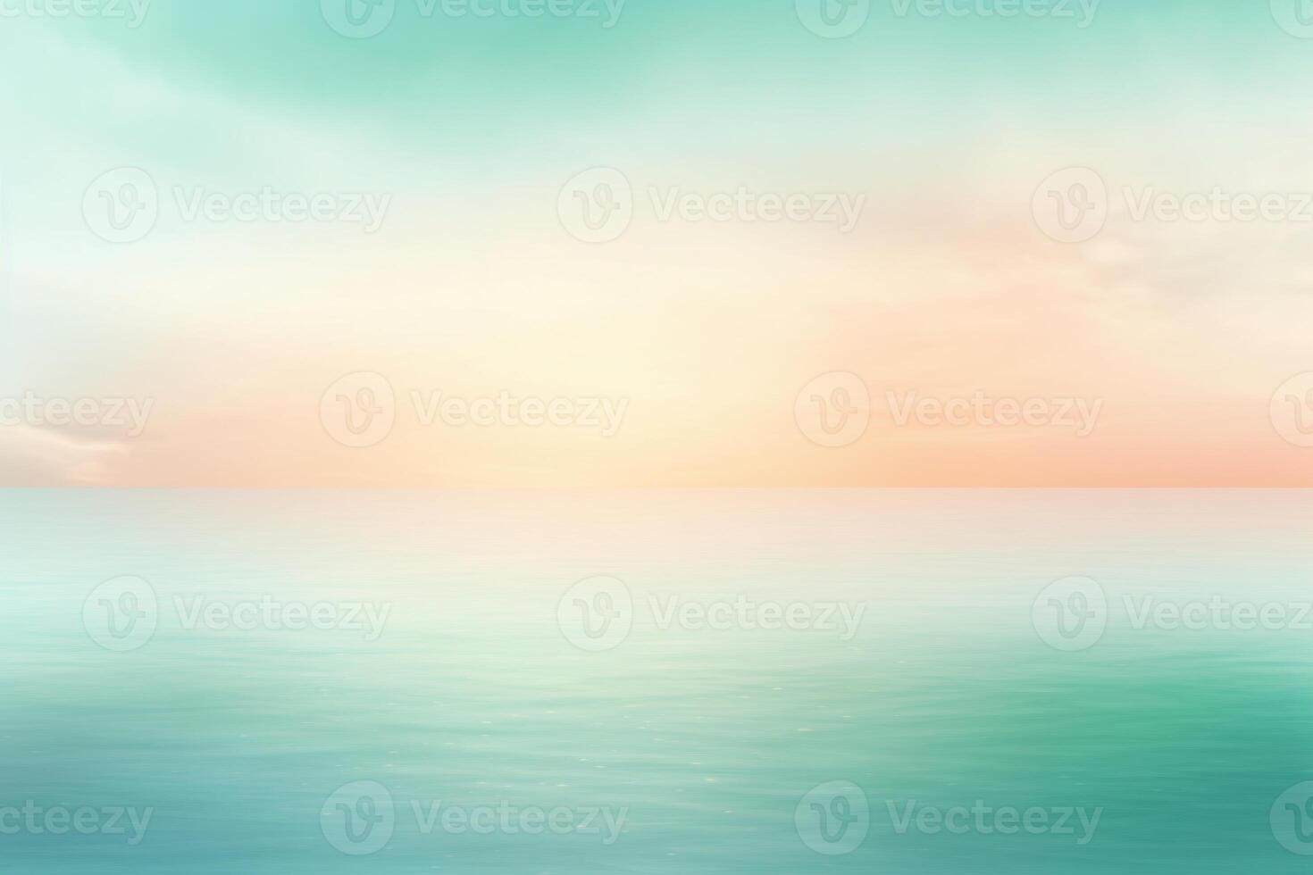 Blurred ocean reflecting pastel colors of sunrise sky photo