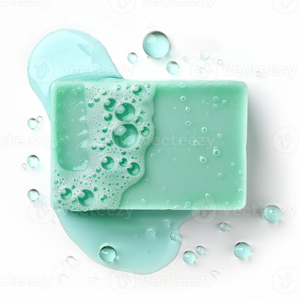 Soap bar with foam and water droplets on white background photo