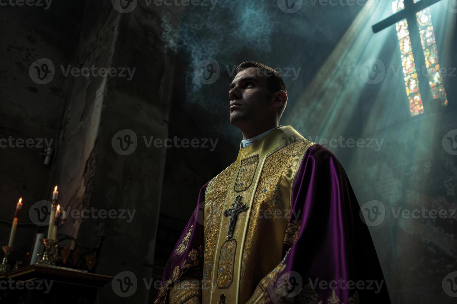 Priest in solemn reflection with divine light in church photo