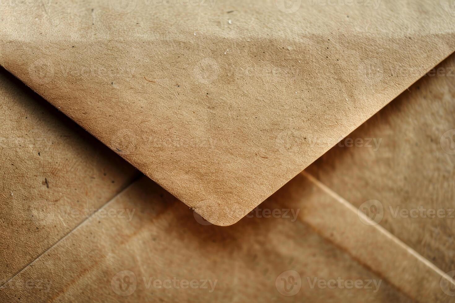 Corner of closed brown recycled paper envelope showing grain photo