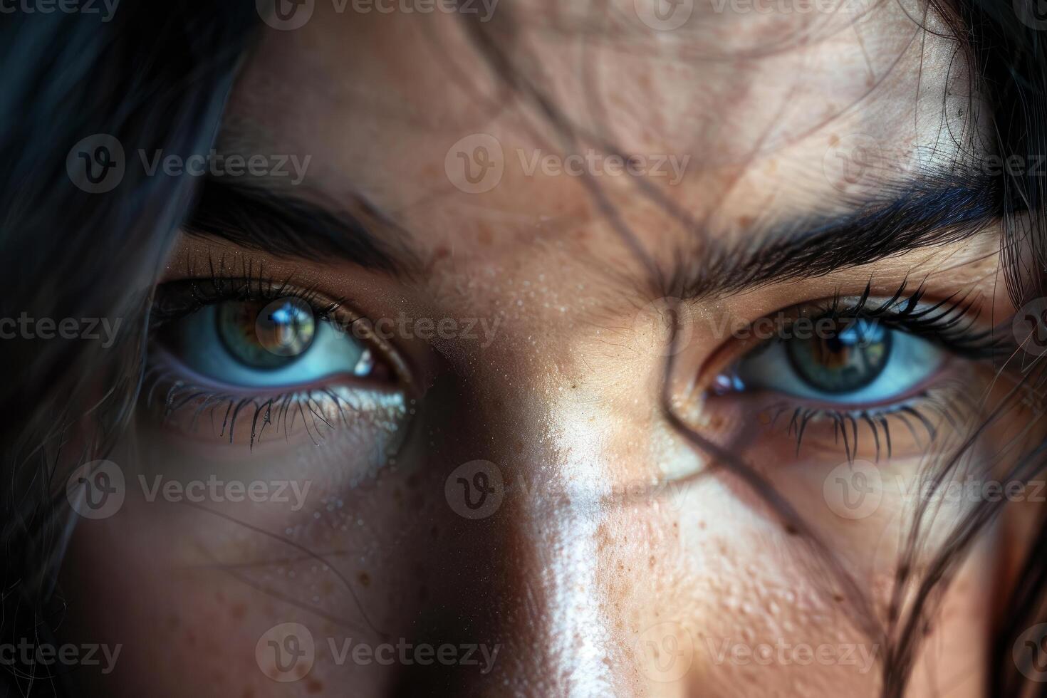 Woman showing expressive eyes with long eyelashes and freckles photo