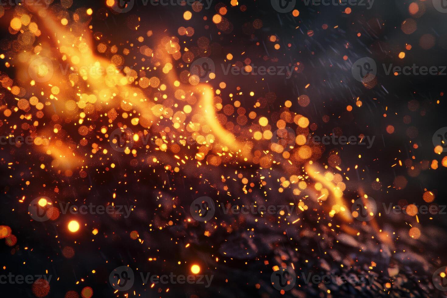 Burning embers emitting glowing sparks and bokeh effect in the dark photo
