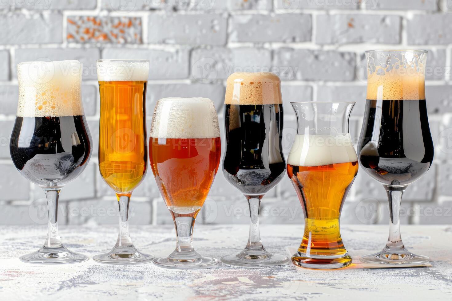 Different beer types in glasses showing variety of styles and colors photo