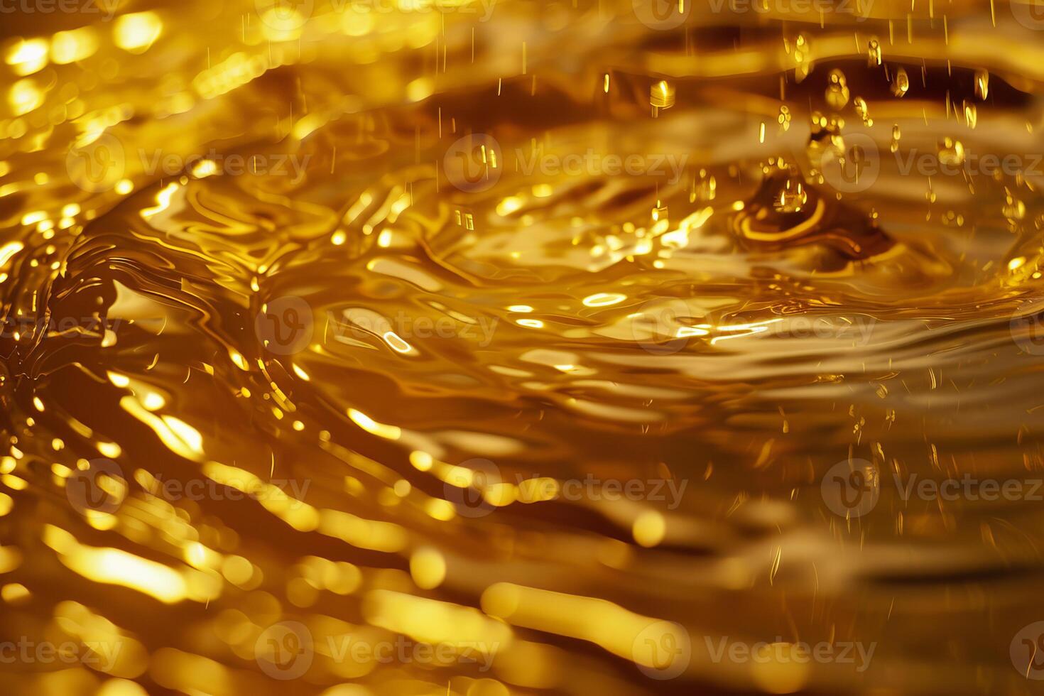 Golden liquid splashing and forming concentric ripples photo