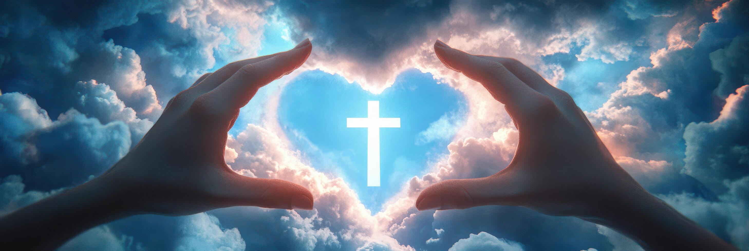 Hands holding a cross in the shape of a heart photo