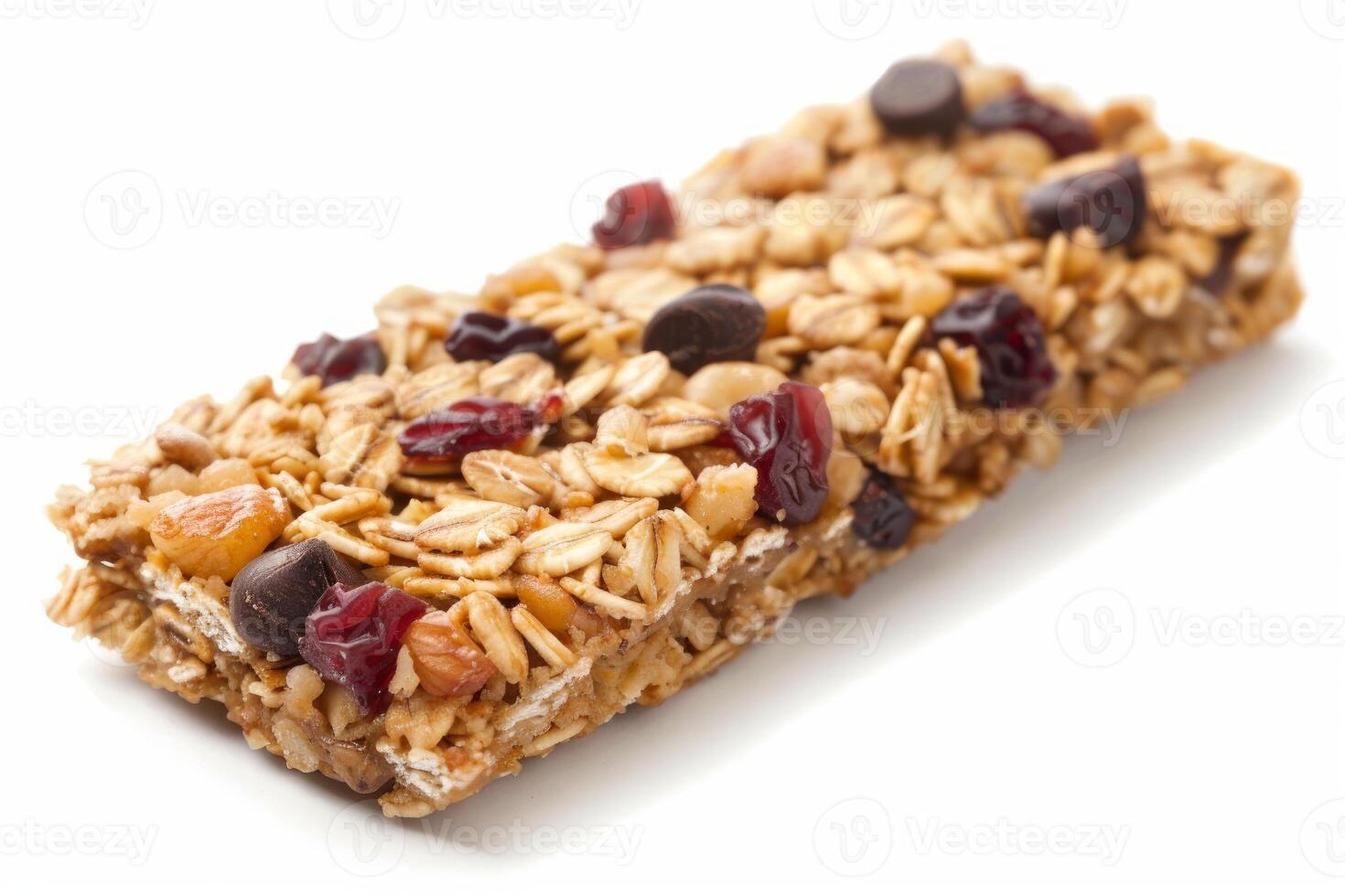 Cereal bar with nuts, dried fruit and chocolate chips on white background photo