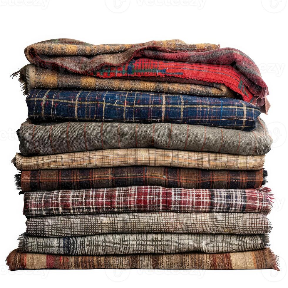 Stack of folded patchwork quilts and blankets creating warmth and comfort photo
