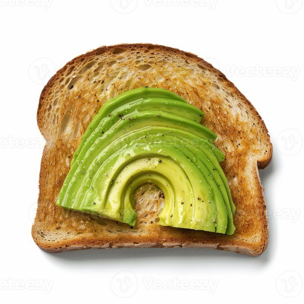 Toasted slice of bread with fresh avocado slices and olive oil seasoned with black pepper photo