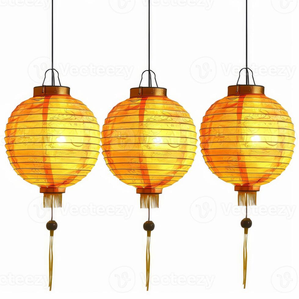 Three illuminated chinese paper lanterns hanging on white background photo