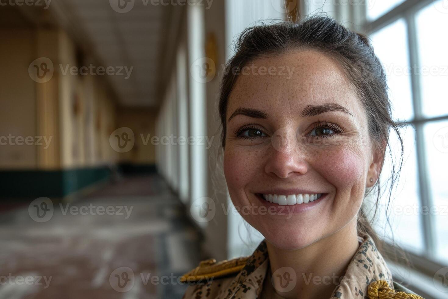 Portrait of a smiling woman in military uniform photo