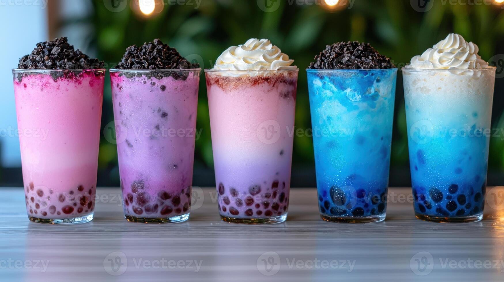 Close up of four refreshing bubble tea drinks with various toppings. photo