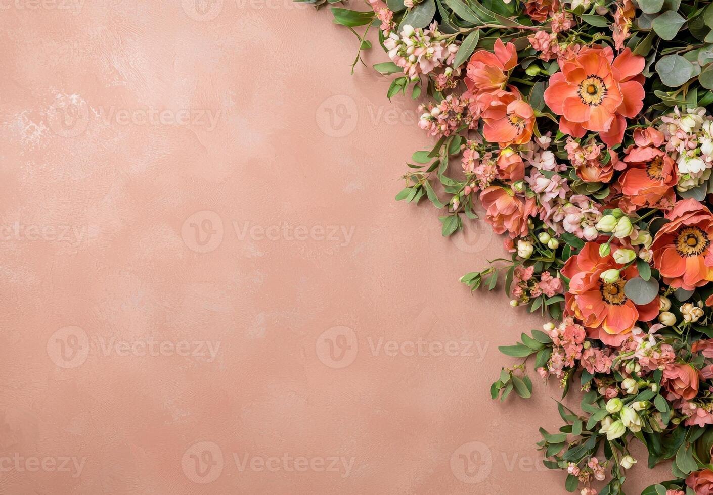 Peach background with orange flowers and greenery photo