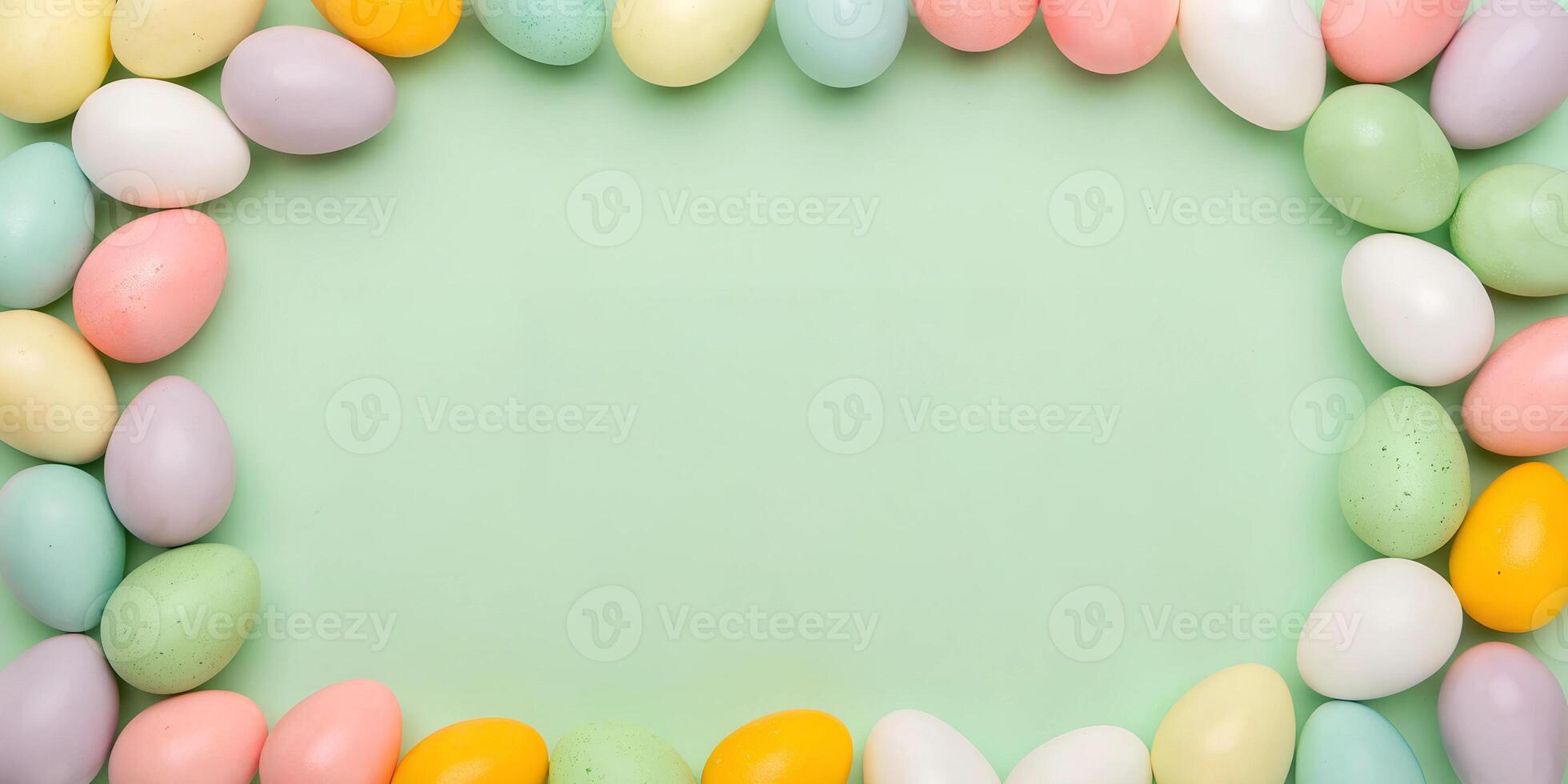 Decorated Easter eggs forming a frame on a green background. Flat lay holiday mockup with copy space photo
