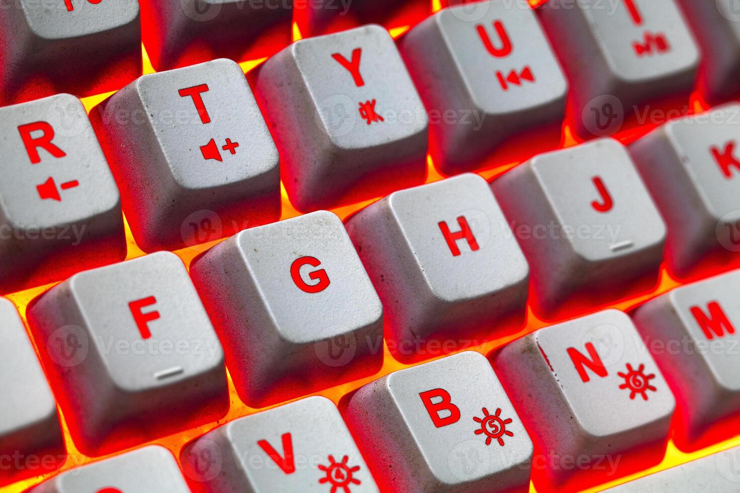 Macro photo of keyboard keys with red yellow bright background rgb color