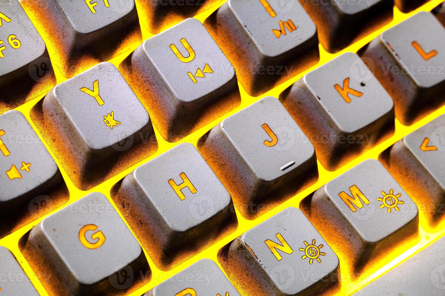 Bright yellow keyboard keys in macro photo