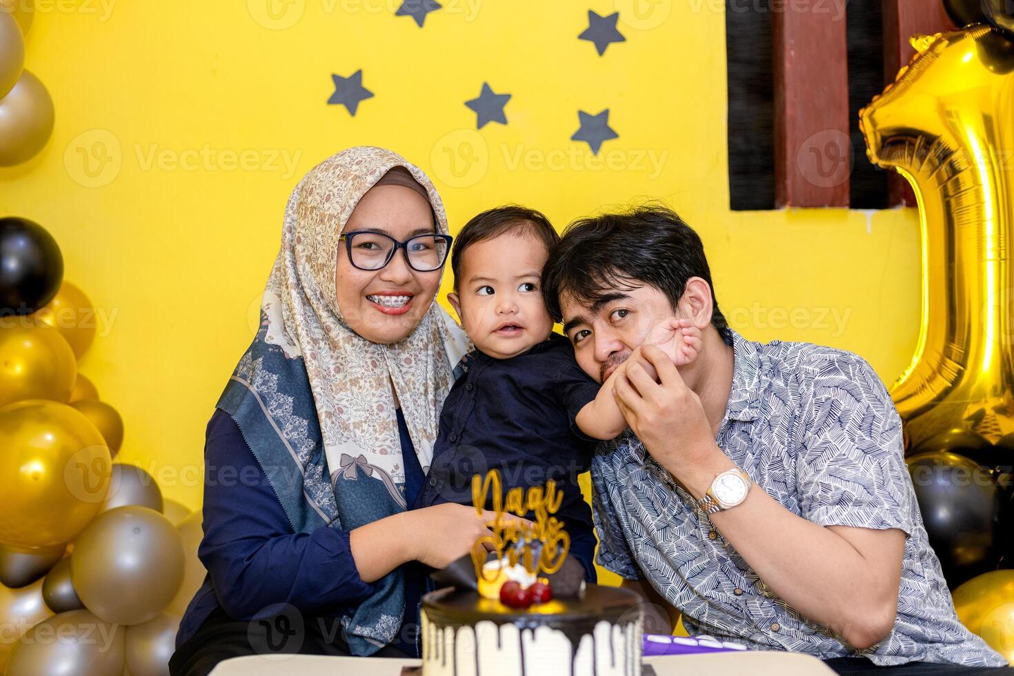 Celebrating Baby First Birthday with Mom and Dad. A Heartwarming Family Celebration with birthday cake, balloon and cute decoration. photo