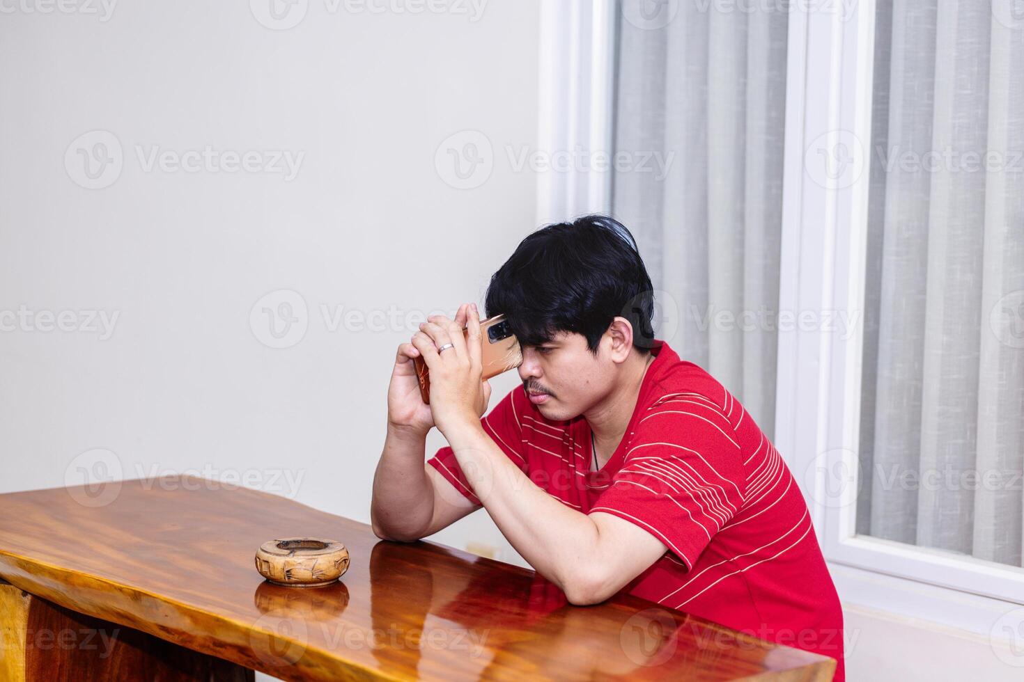 Man Considering Decisions While Sitting. Serene Moment of a Man in Deep Thought. photo