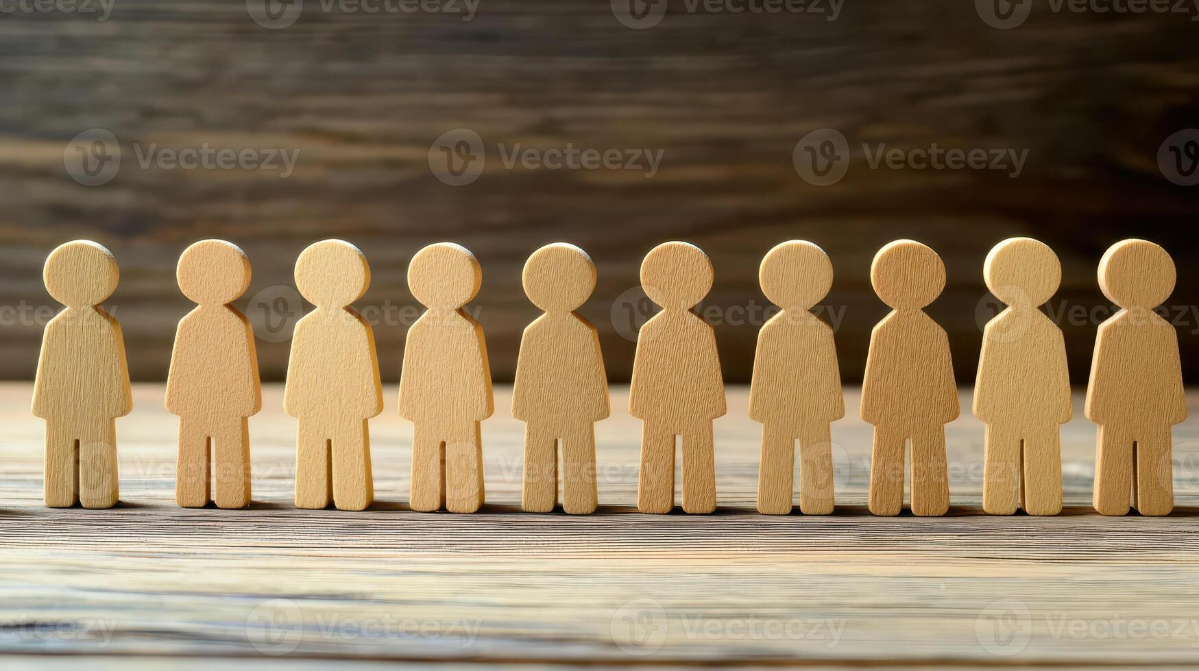 A group of wooden people standing in a line photo