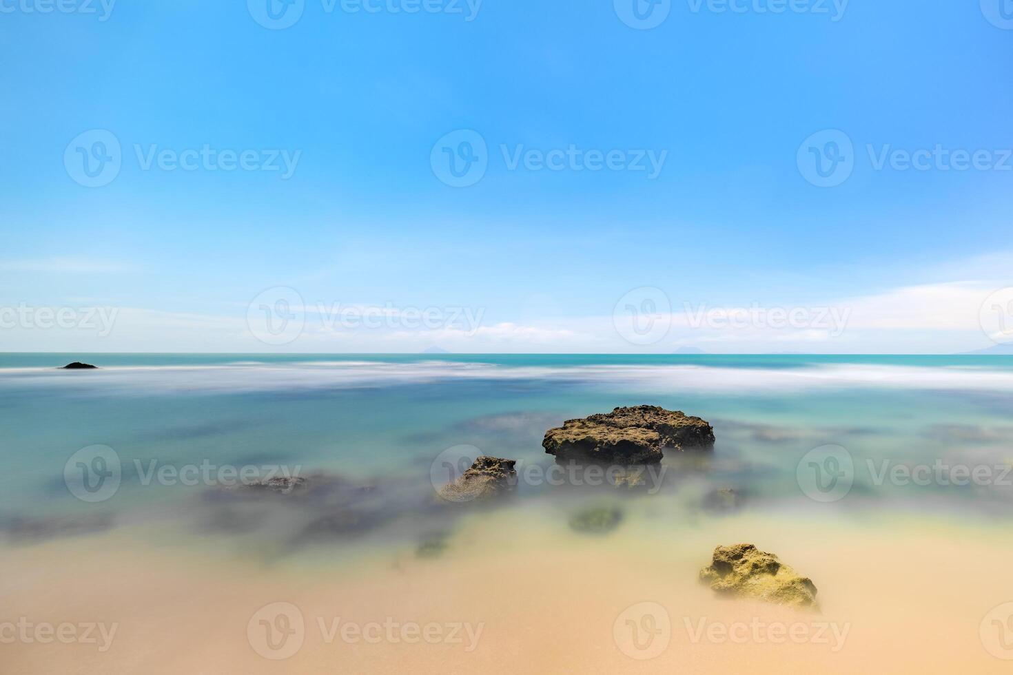 Smooth Ocean Waves Under a Vibrant Sky. Serene Ocean View with Gentle Waves. photo