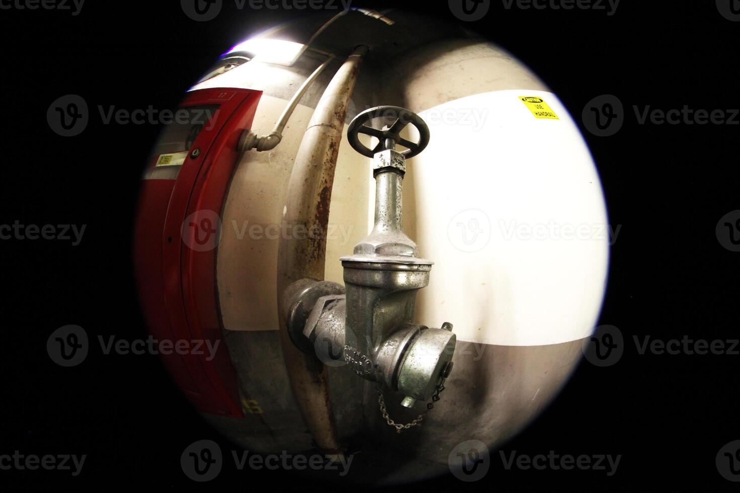 Water Valve in Hallway of a Parking Garage in Downtown Los Angeles, California photo