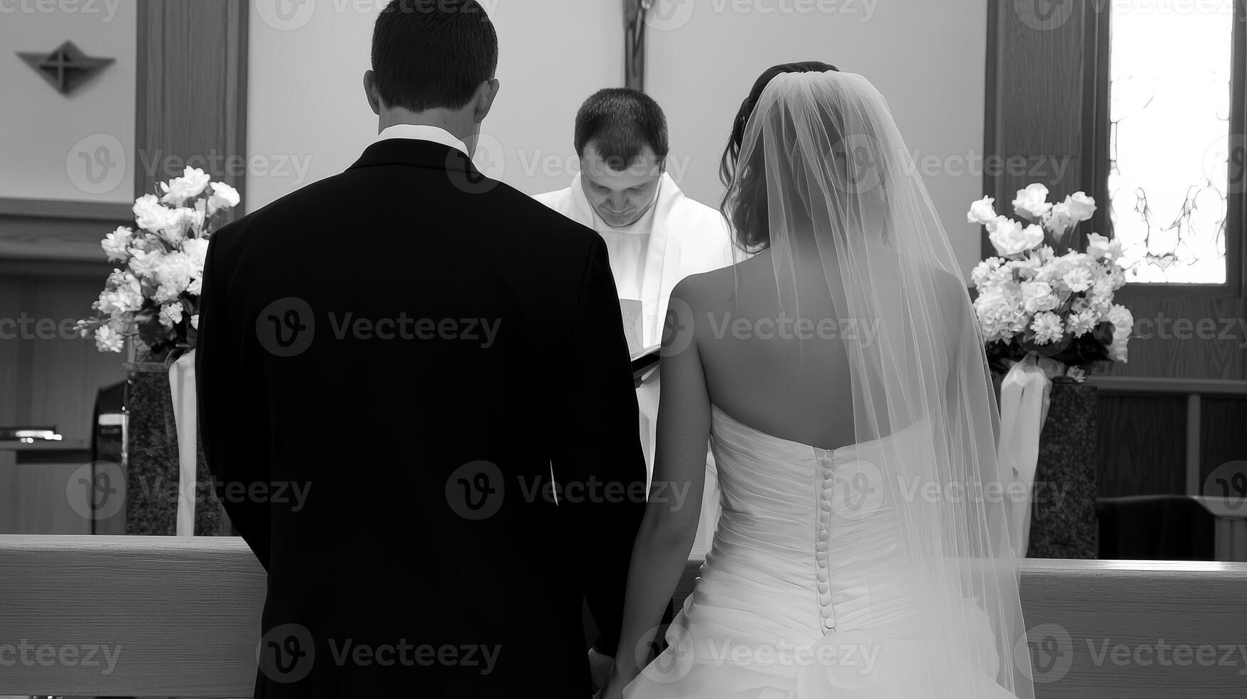 Black and White Wedding Ceremony Bride and Groom Holding Hands at the Altar photo