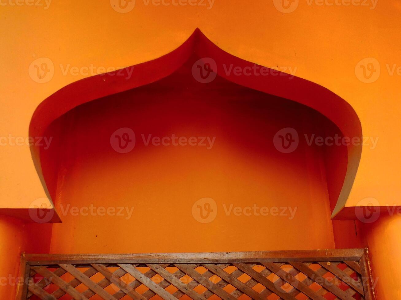 Islamic architectural background. Archway with an orange color and has a lot of detail. photo