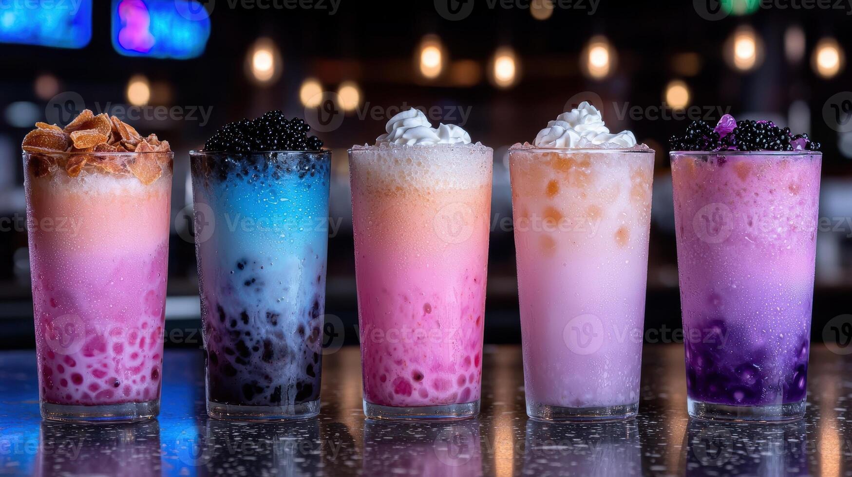 Five colorful layered drinks with boba and whipped cream photo