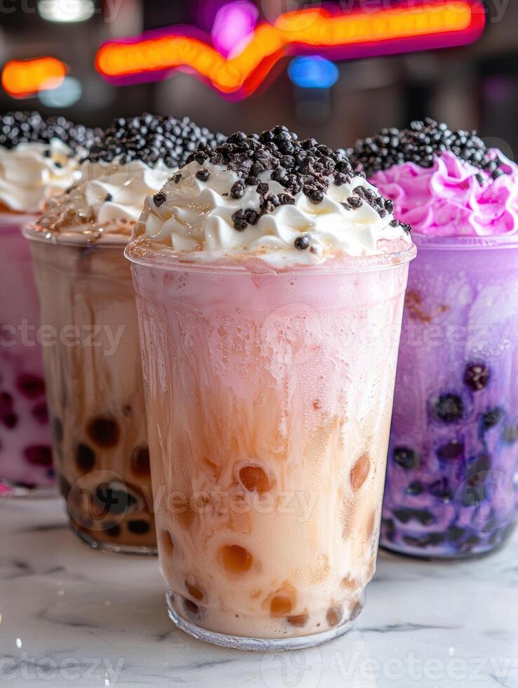 Close up of three creamy bubble tea drinks with tapioca pearls photo