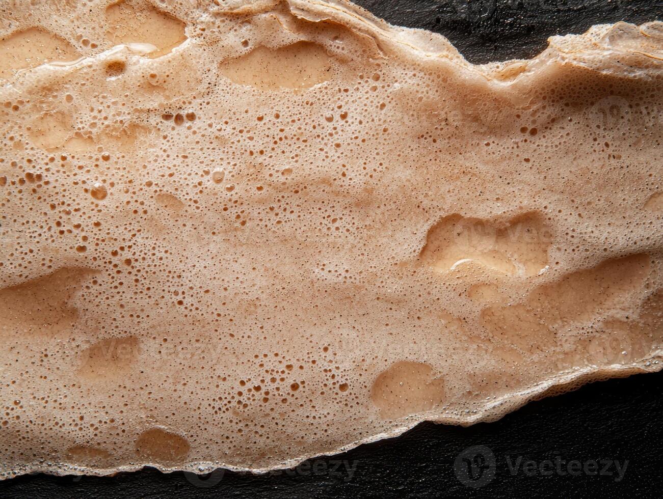 Close up of creamy foam texture with air bubbles photo