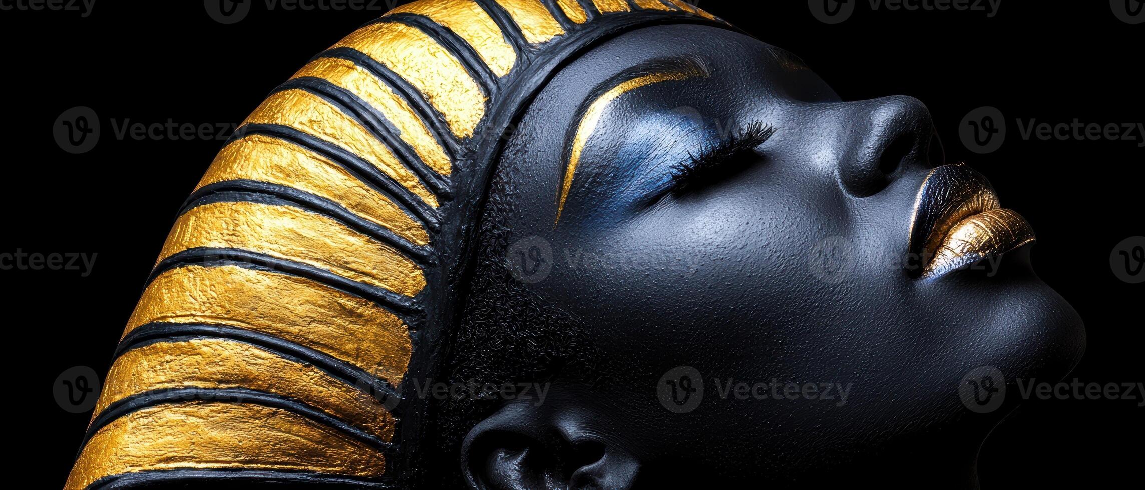 Close up of a womans face with gold and black makeup, wearing a gold and black headdress photo
