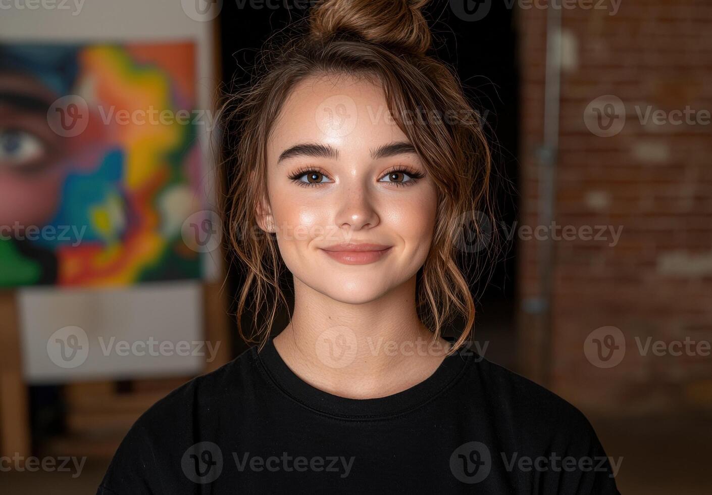 Portrait of a young woman with a bun hairstyle, smiling gently photo