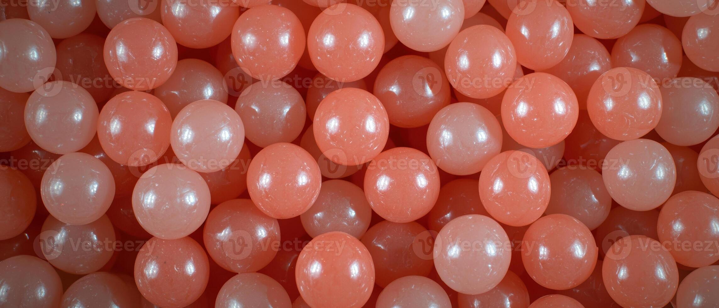 Coral colored plastic balls background photo