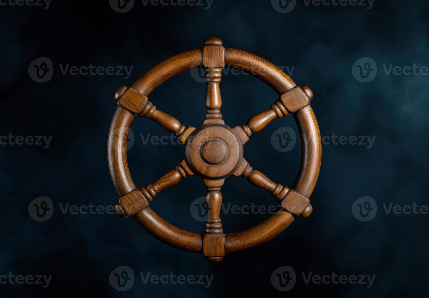 Vintage wooden ship wheel on dark background photo