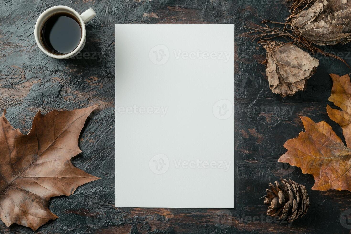 Blank paper on rustic wooden table with autumn leaves and coffee photo