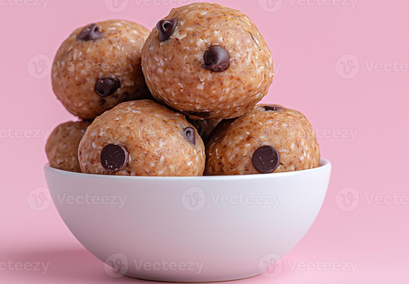 Delicious chocolate chip energy balls in a basic white bowl. photo