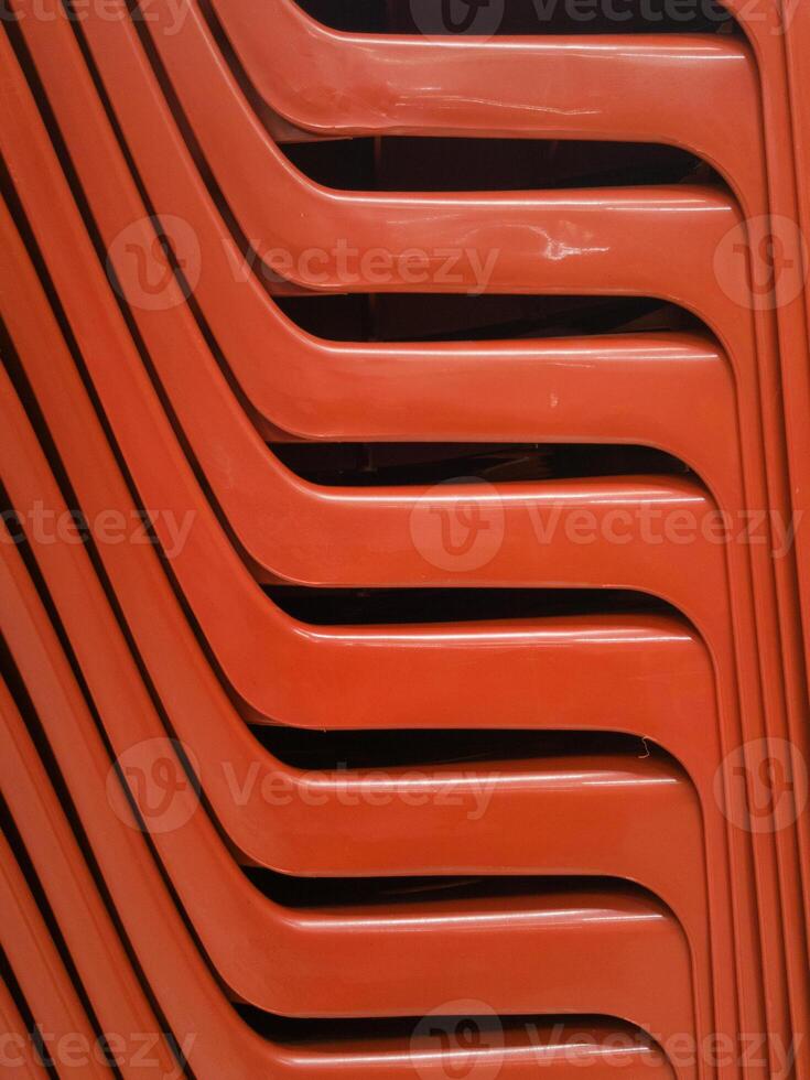details of stack red chairs from hard plastic. abstract photo