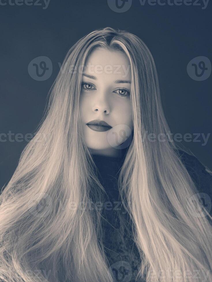 Woman, monochrome portrait with soft focus, long flowing hair and serene expression. Timeless beauty, elegant pose, and captivating look photo