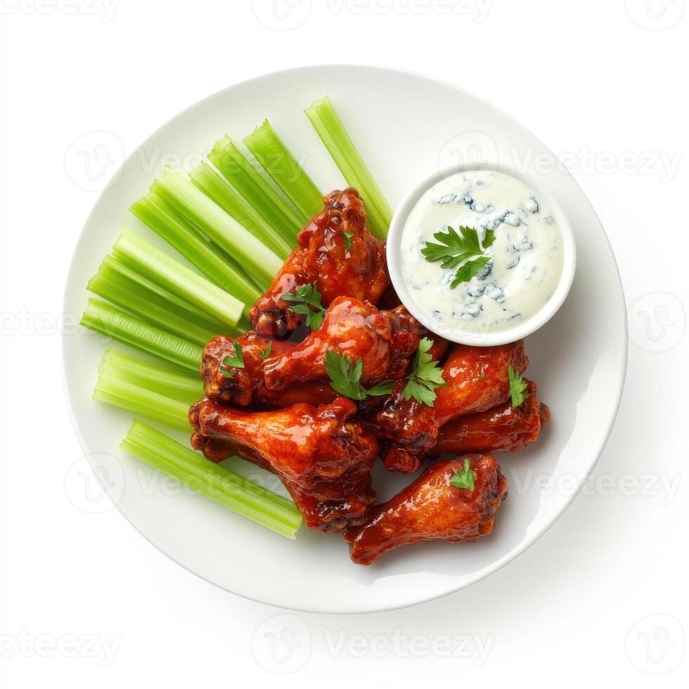 Baked chicken wings with celery and sauce photo