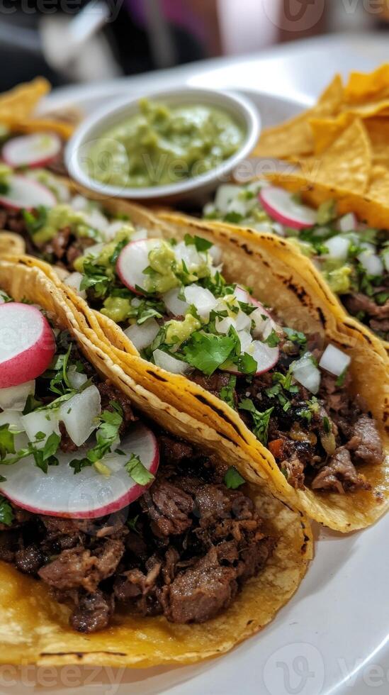 Mexican beef tacos with guacamole and fresh radish photo