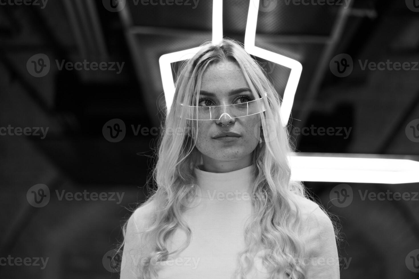 Portrait of a blonde in neon glasses. photo