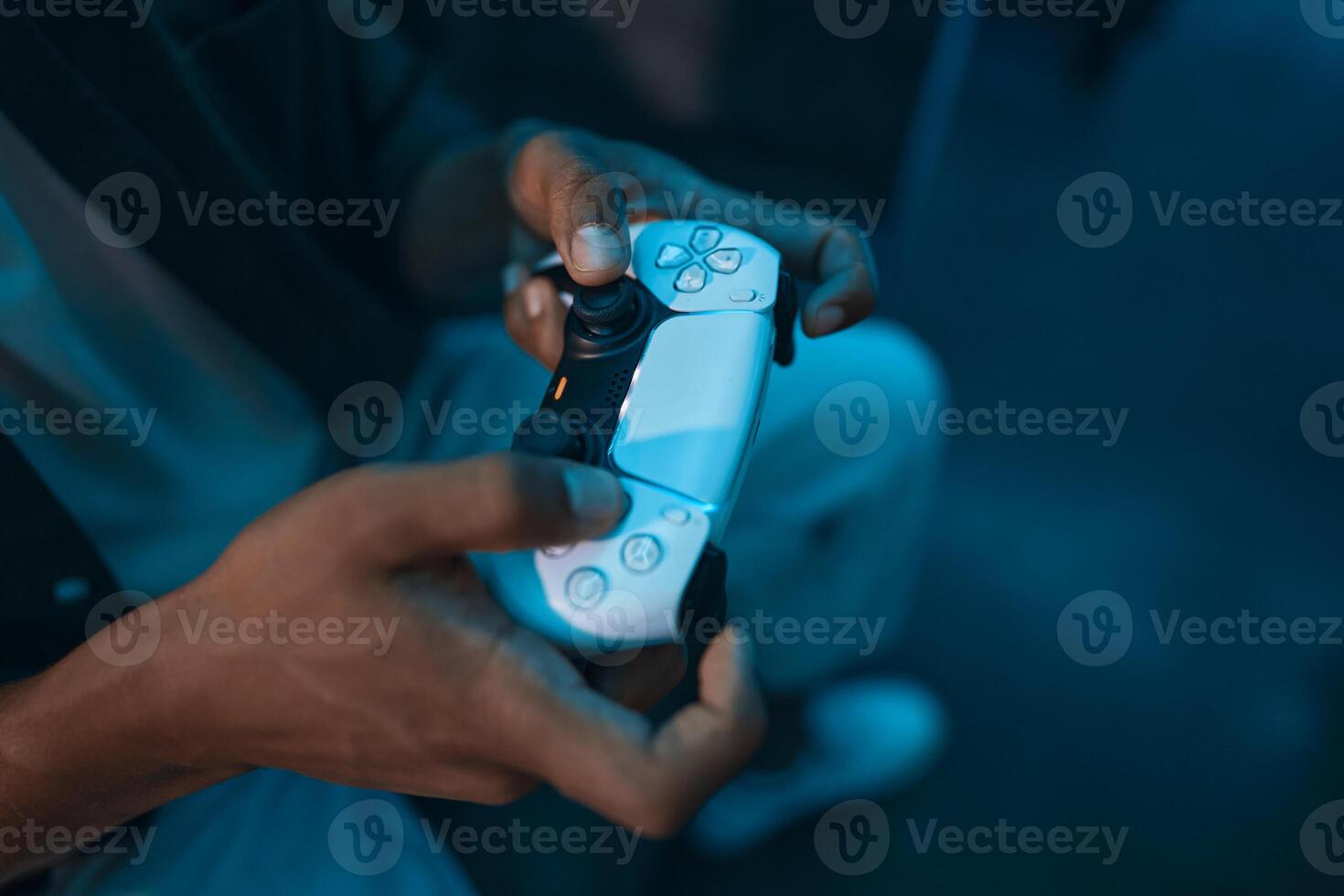Gamepad in player's hands. photo