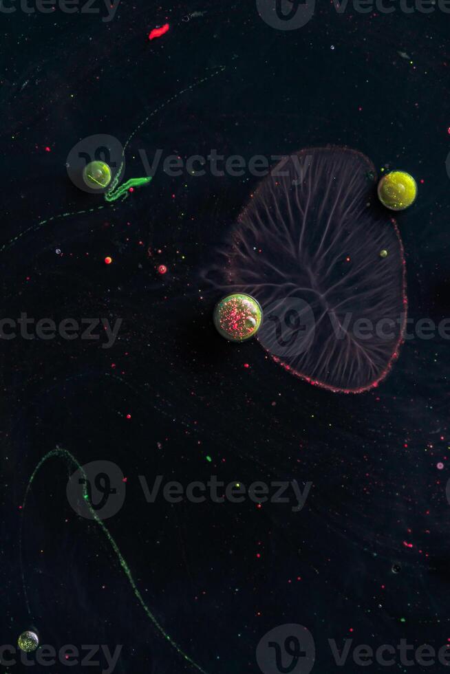 Paint in water. Amazing macro photography in the form of space and planets. photo