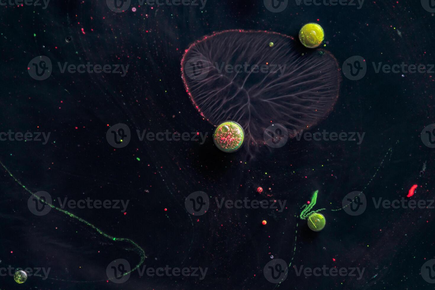 Paint in water. Amazing macro photography in the form of space and planets. photo