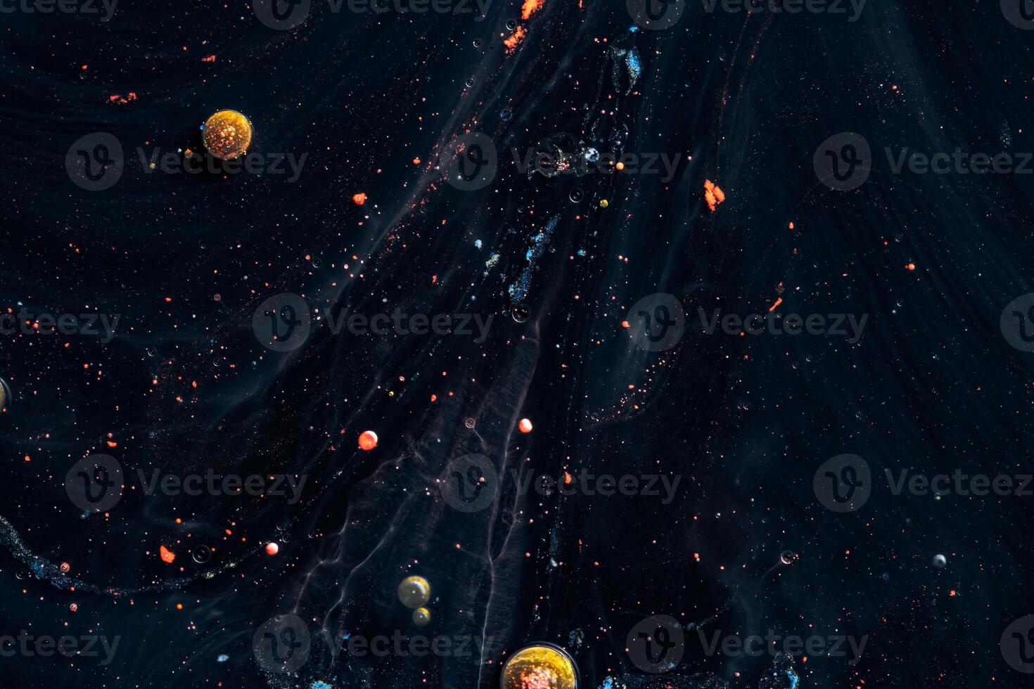 Paint in water. Amazing macro photography in the form of space and planets. photo