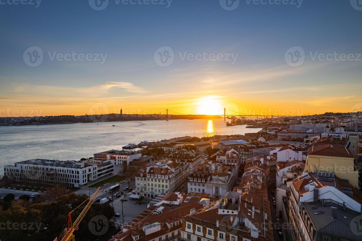 Breathtaking sunset over Lisbon with river views and colorful rooftops photo