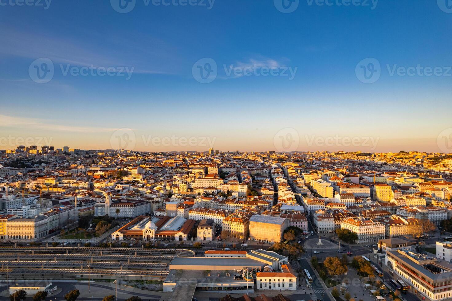Panoramic view of Lisbon at sunset showcasing urban architecture and skyline photo