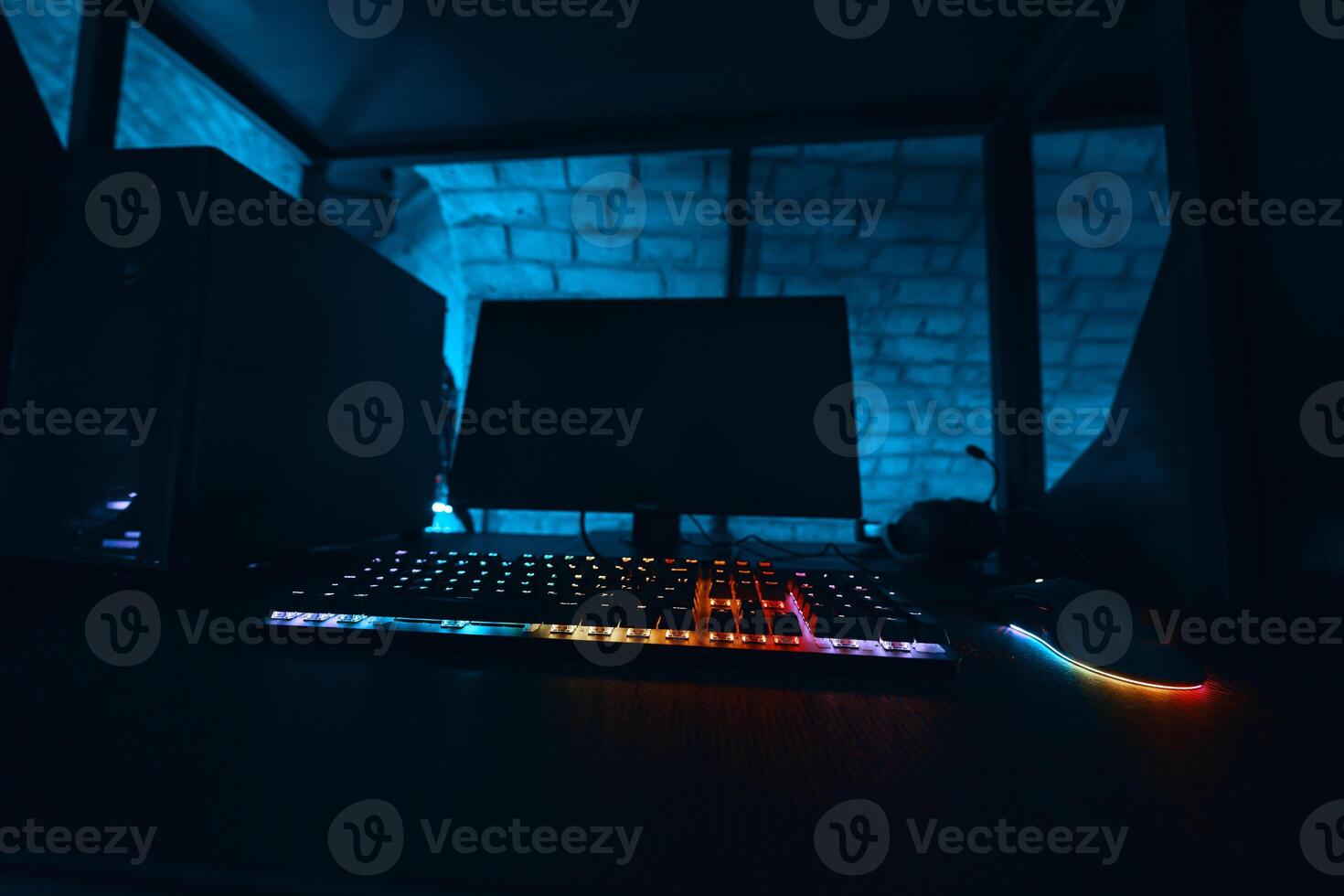Excluded gaming computer with neon keyboard. photo